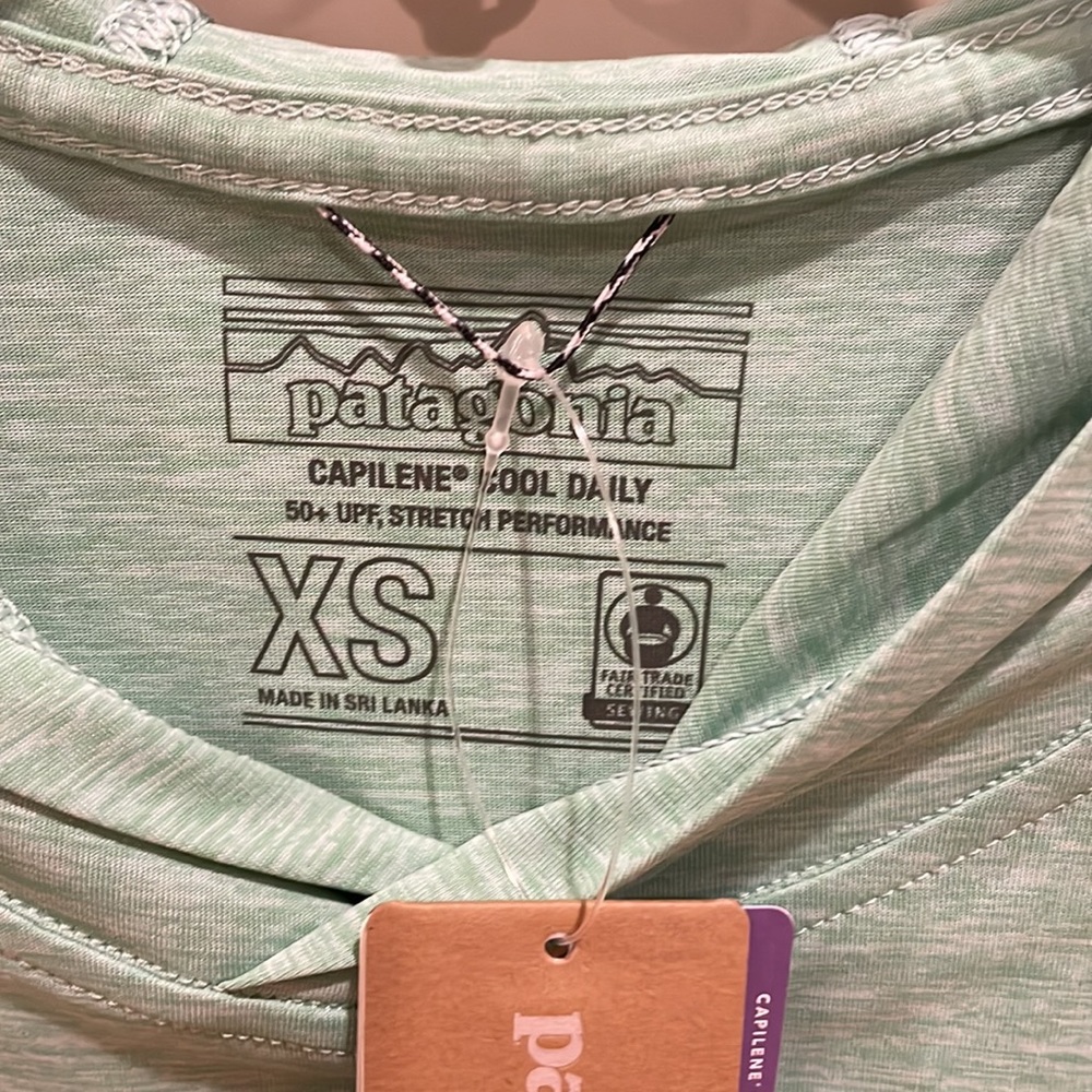Long sleeve NWT Patagonia hooded women’s outdoor top.  Seafoam green, x-small.